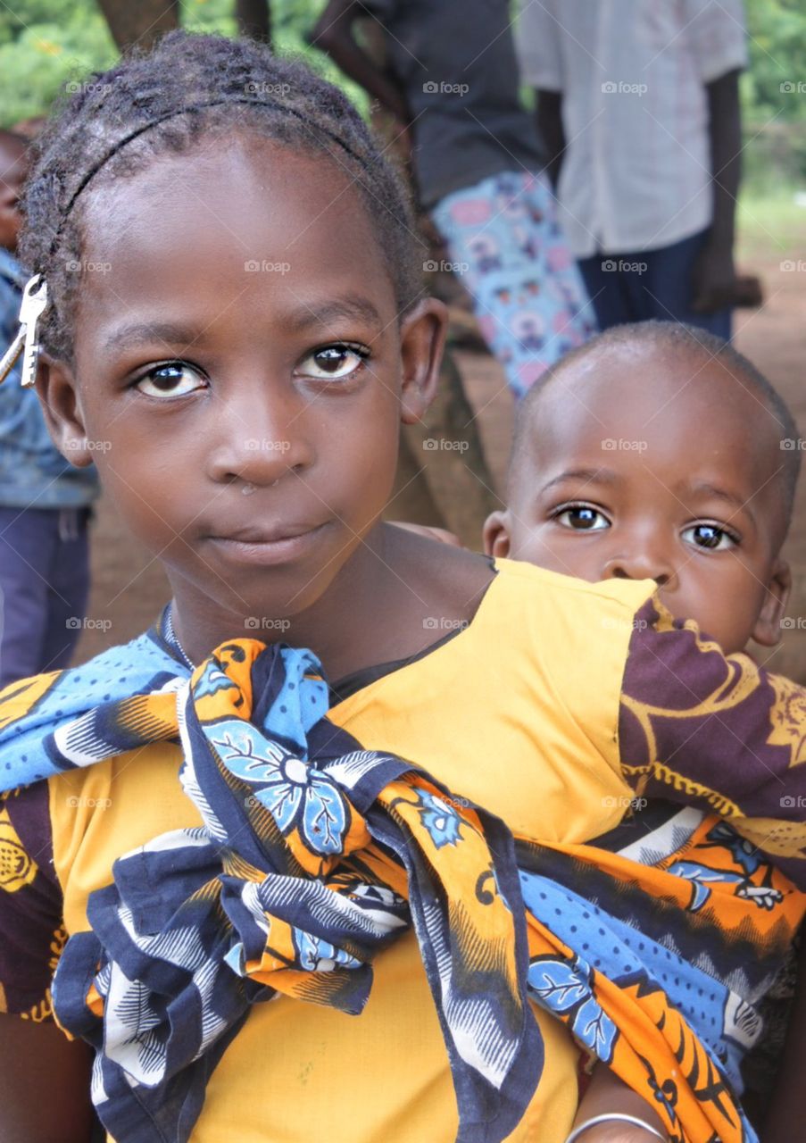 Child carrying baby