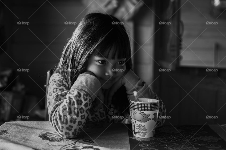 A little girl lost in her thought