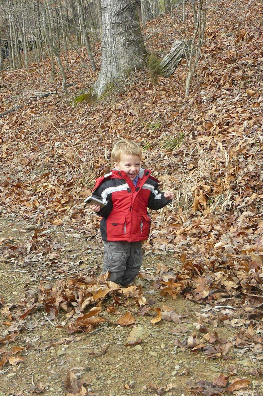 Boy in leaves