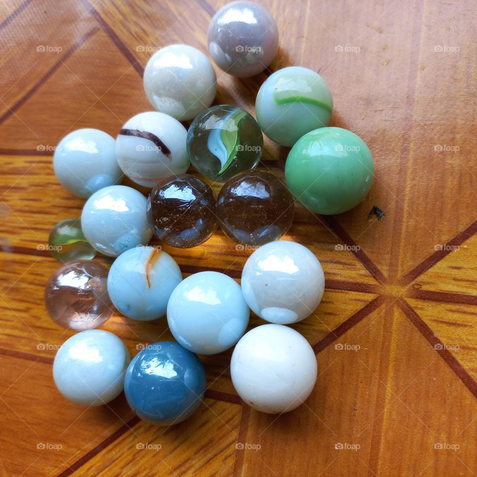 Small balls made of marble or glass clay for children's games