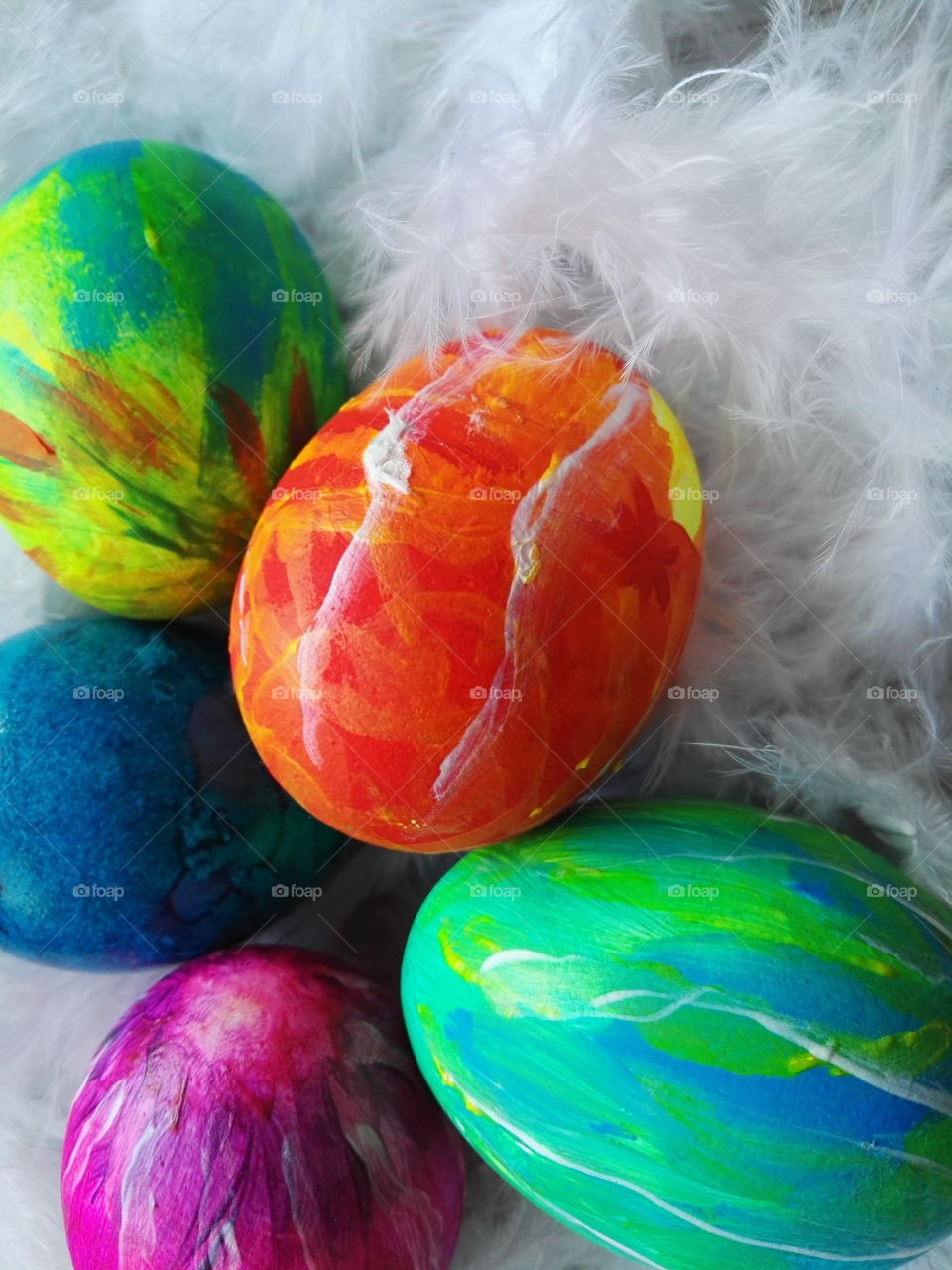 easter eggs on white fethern