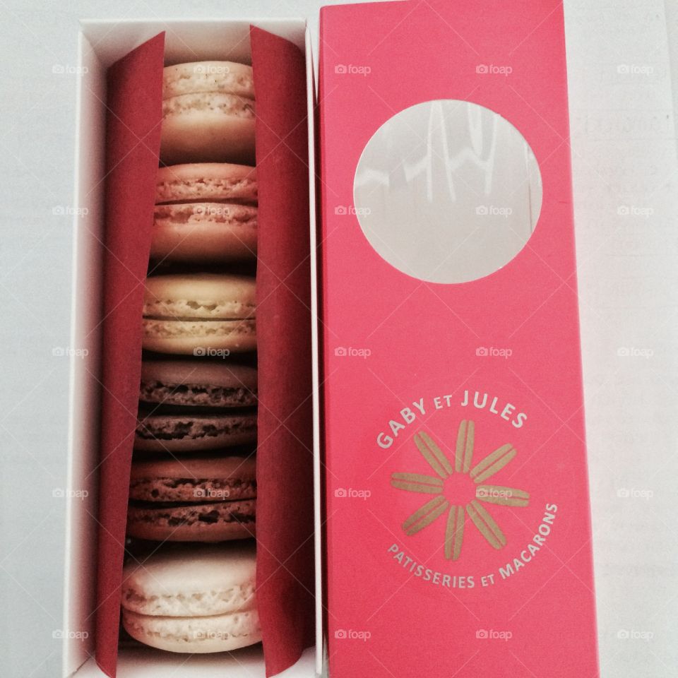 Bright and cute packaging for a sleeve of macarons of assorted flavors. 6 different and tasty flavors.