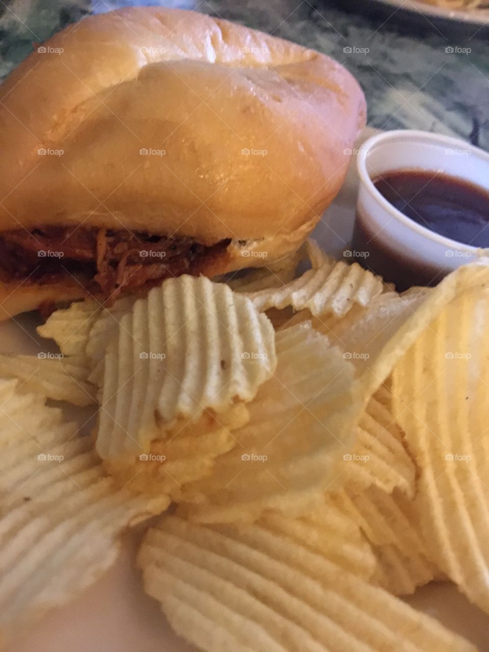 BBQ Pulled Pork Sandwich and Potato Chips