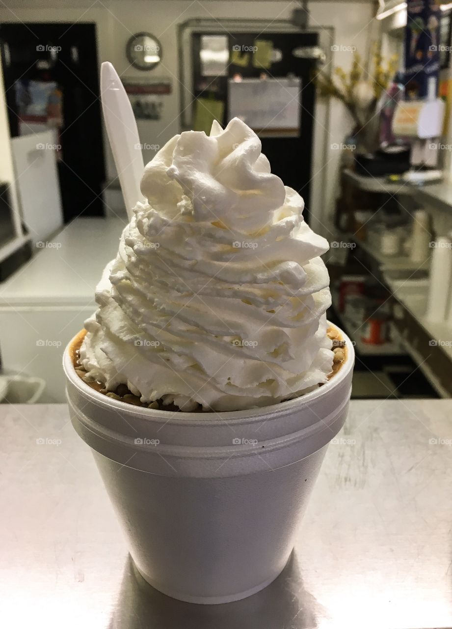 Yes, please!  Photo of a delicious ice cream sundae with a lot of yummy, fluffy whipped cream. 