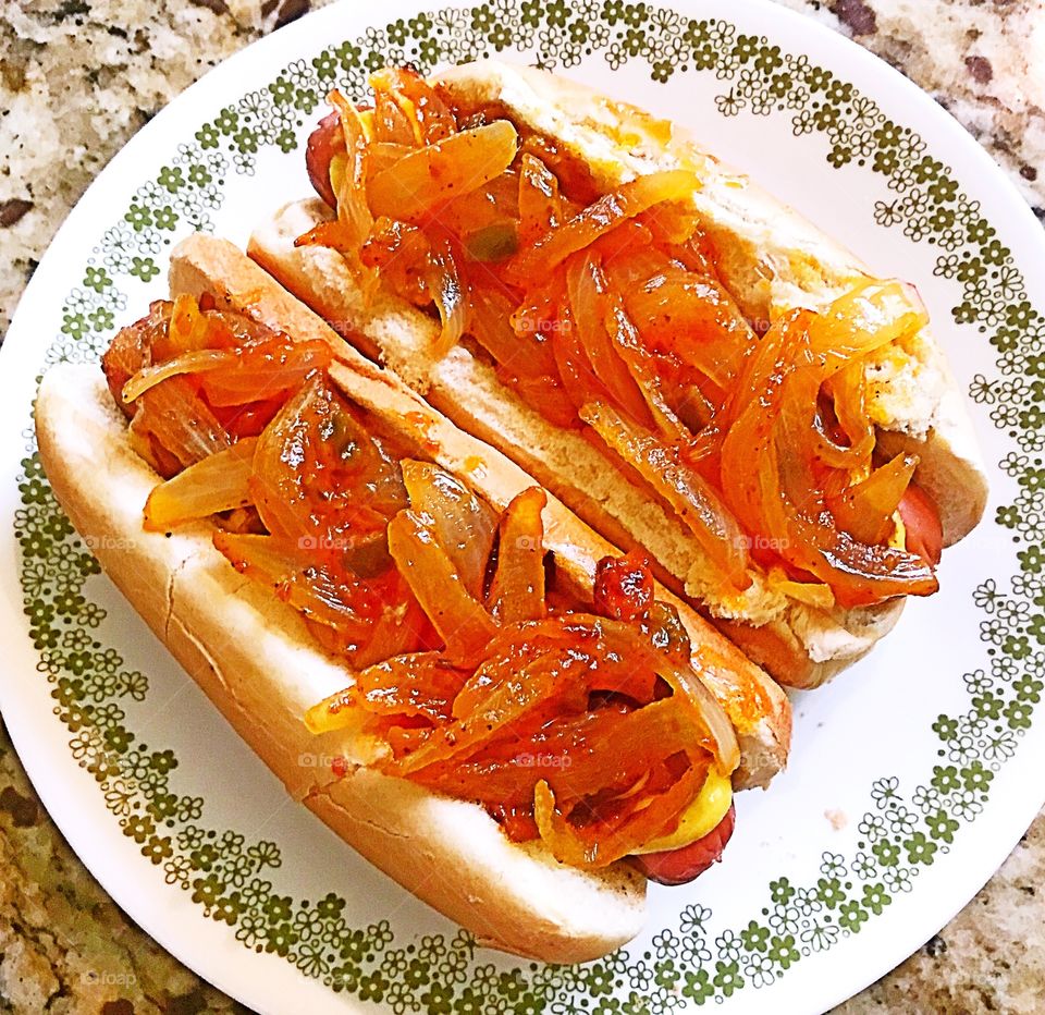 All beef hotdogs with spicy onions and tomato sauce 