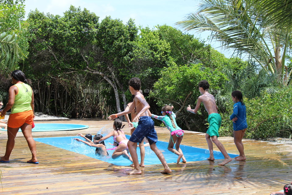 kids jumping in the pool