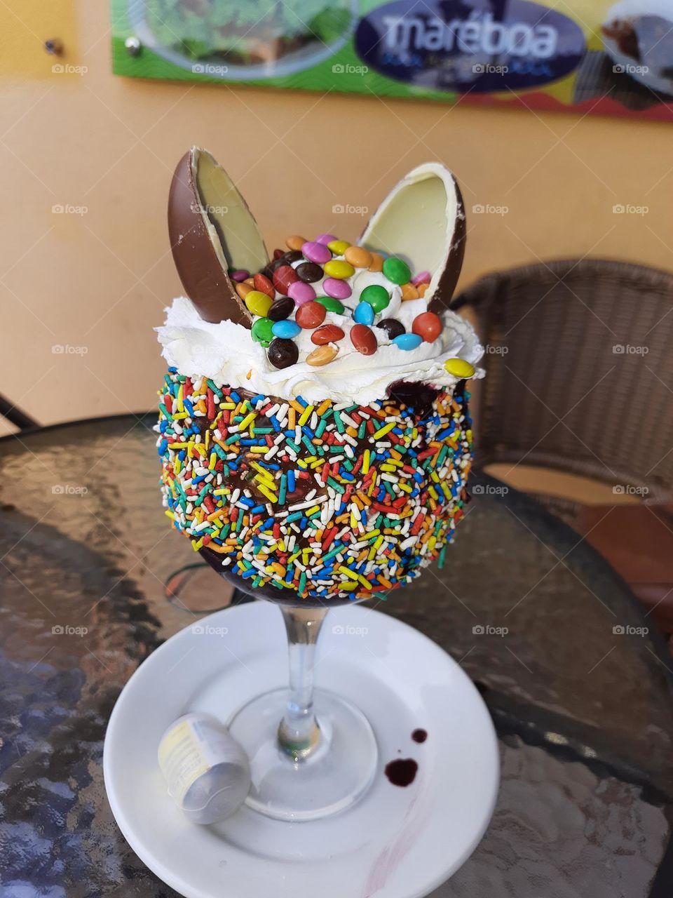 ice cream in the cup with sprinkles