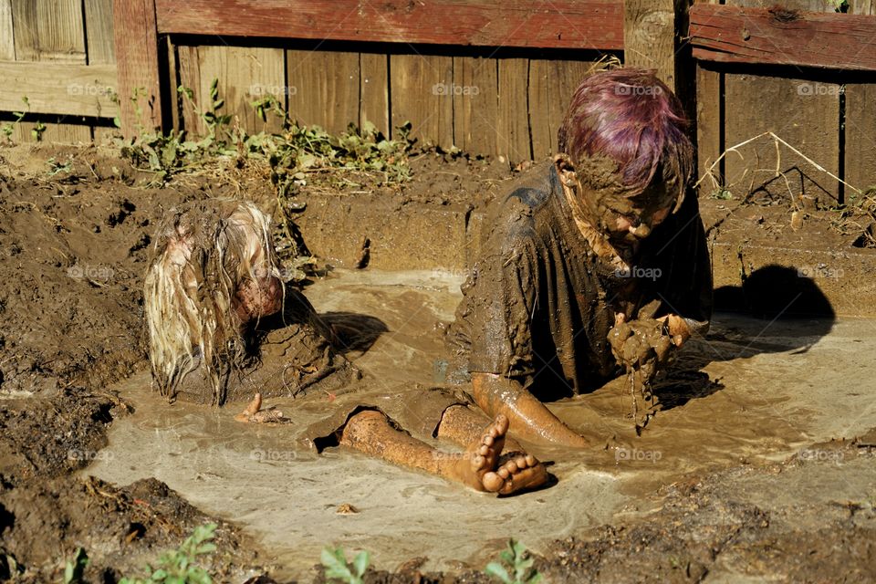 Kids Playing In Mud