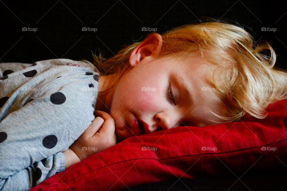 Pretty girl sleeping on bed
