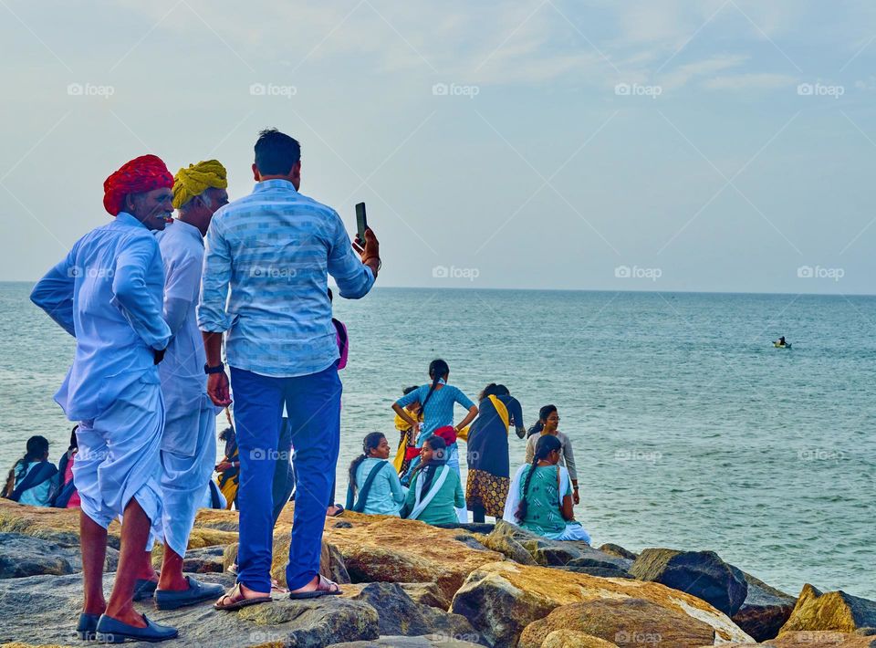 Strangers meeting in a tourist spot and taking selfie