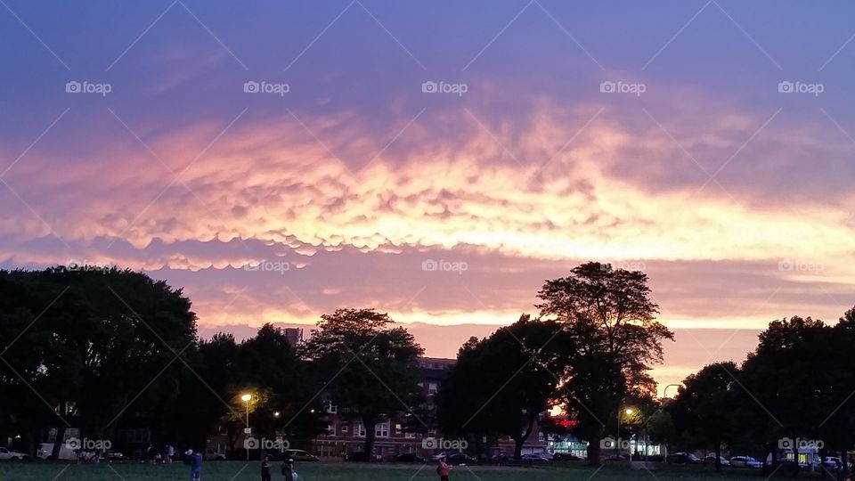 Clouds over Koz Park Chicago . Sunset walk through neighborhood park when the sunset displayed mammatus clouds.