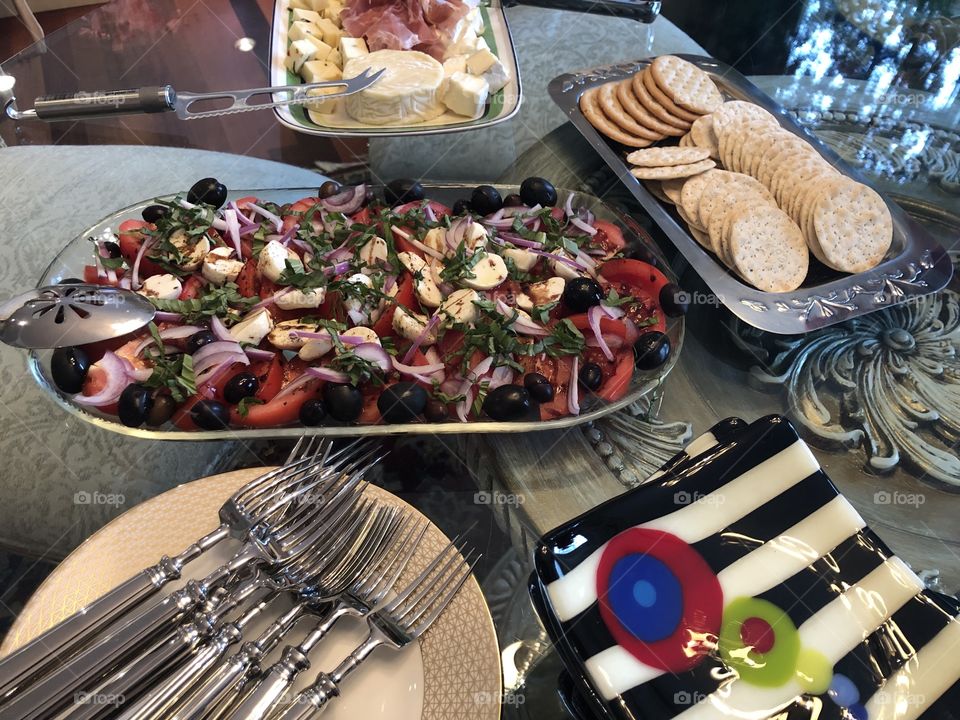 Table set up with appetizers plates and silverware