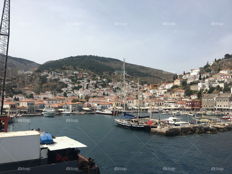 A port view of the picturesque island of Hydra in the middle of the historic Aegean Sea.