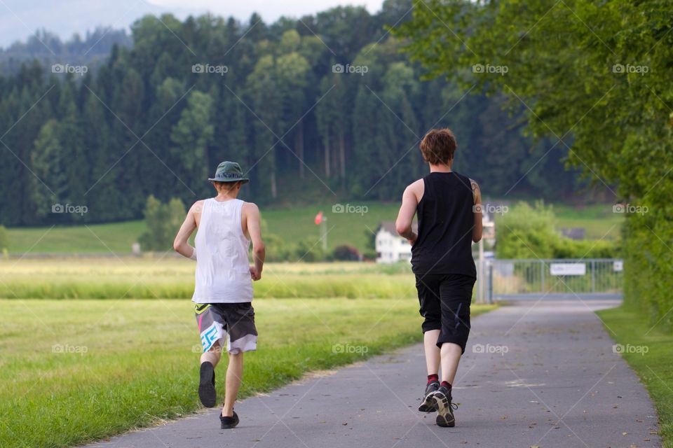 Friends Jogging Around Lake