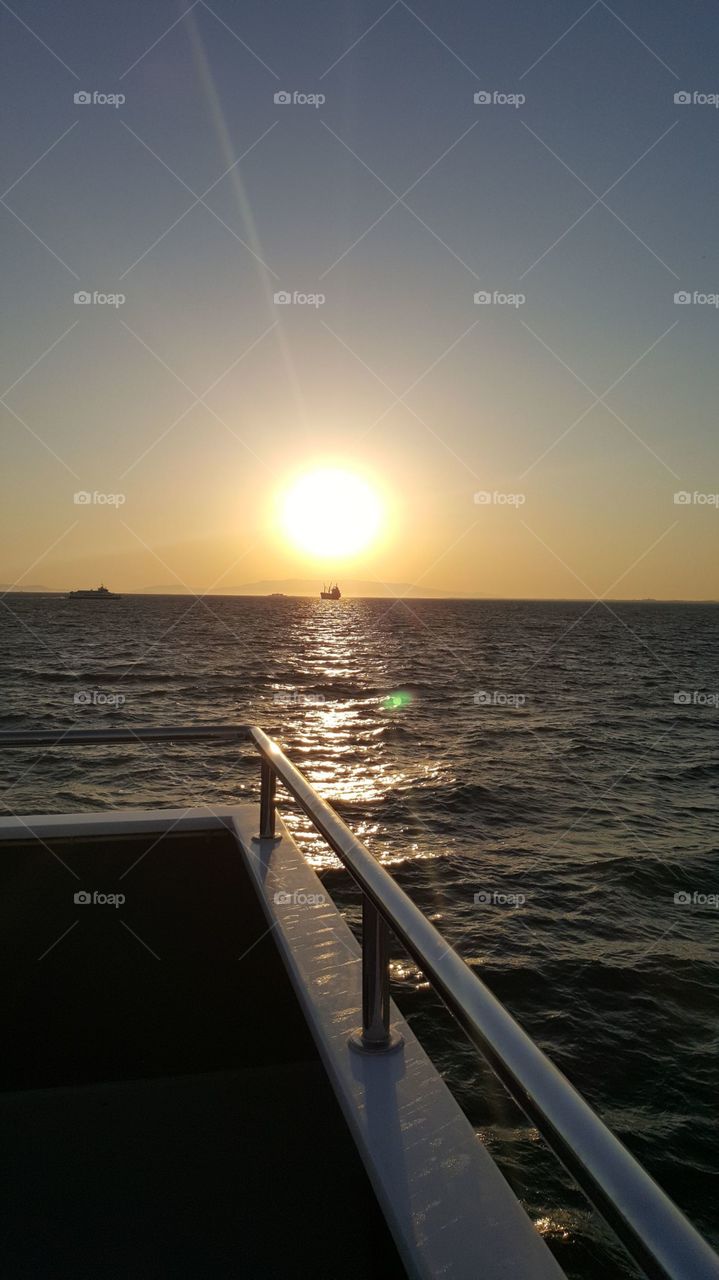 sunset ferry sea