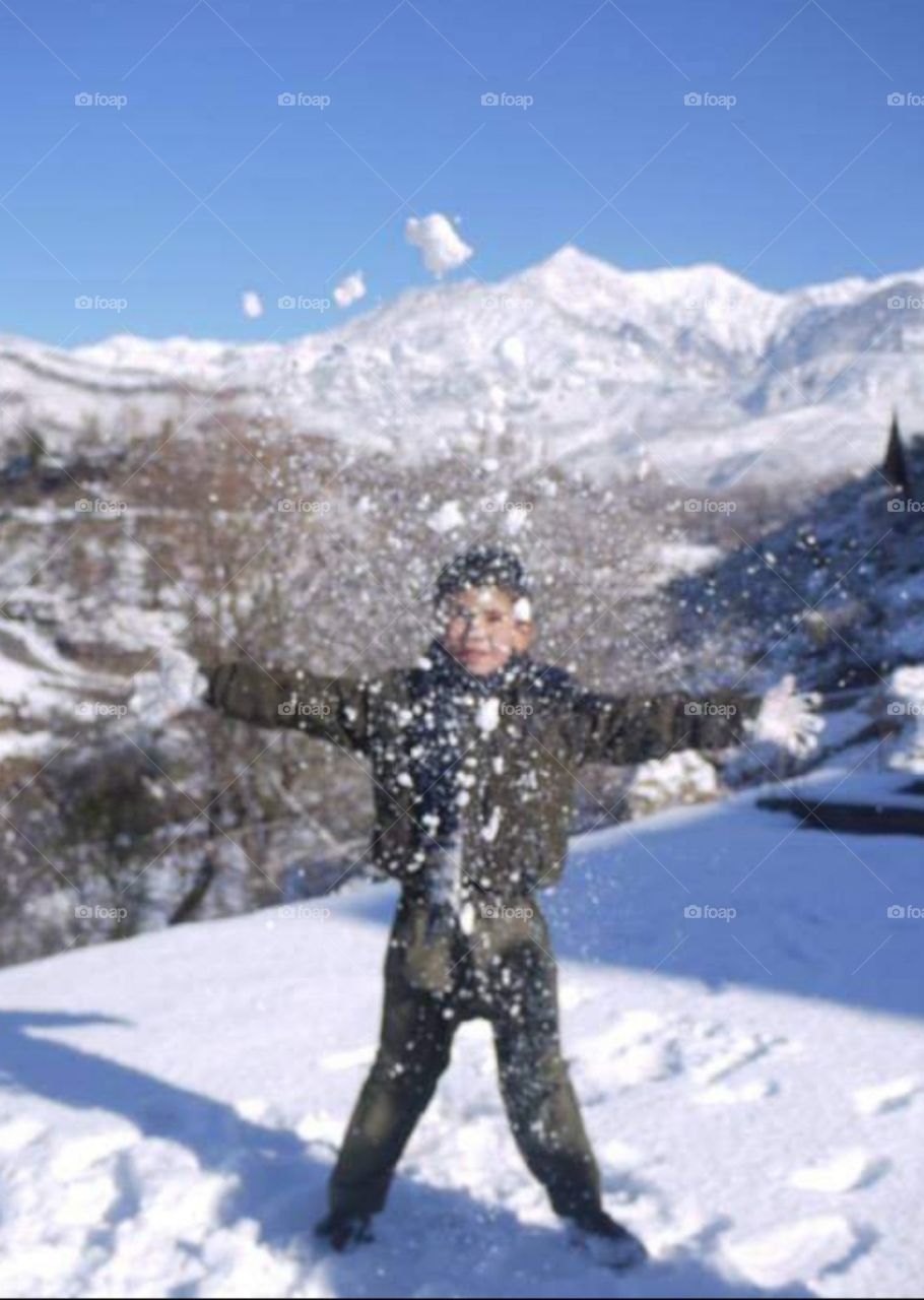 boy play in snow