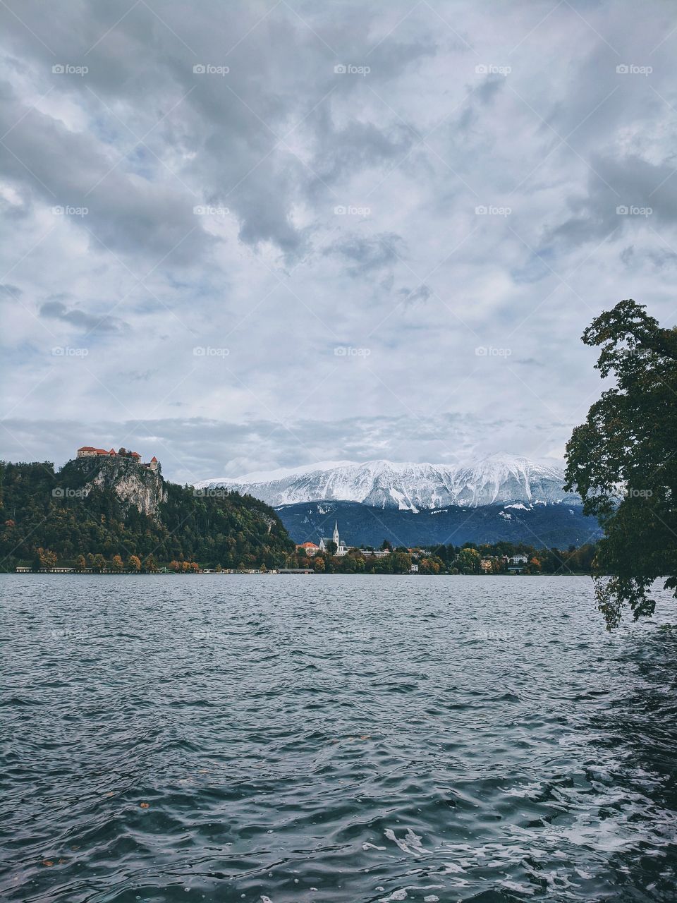 Scenic view at the snowcapped mountains at lake Bled.