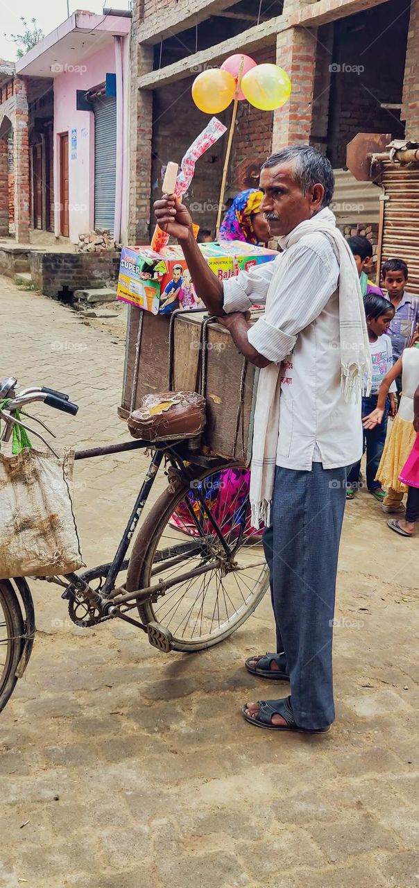 Man selling icecream to feed his family