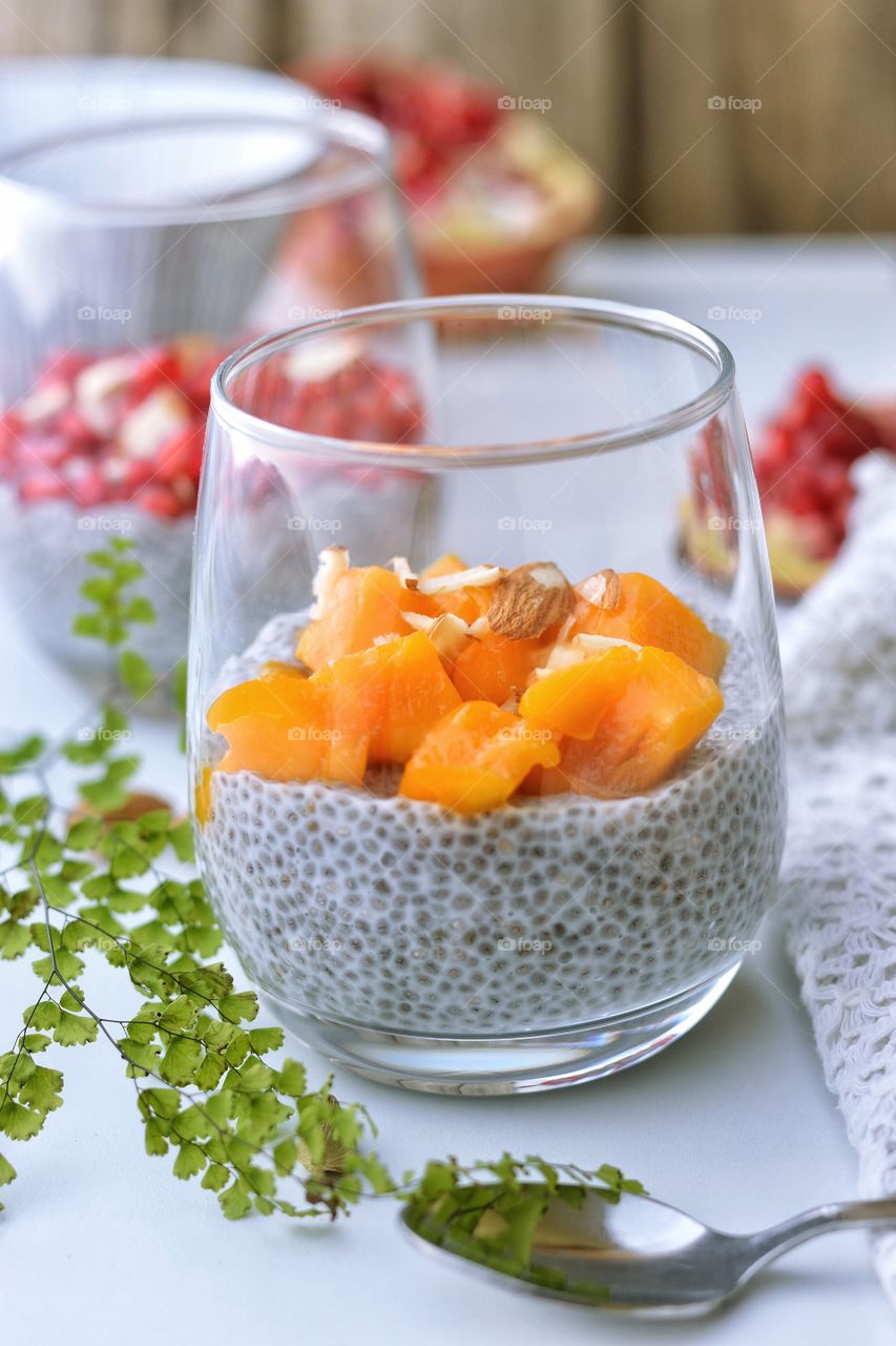 coconut and chia seeds pudding with mango slices