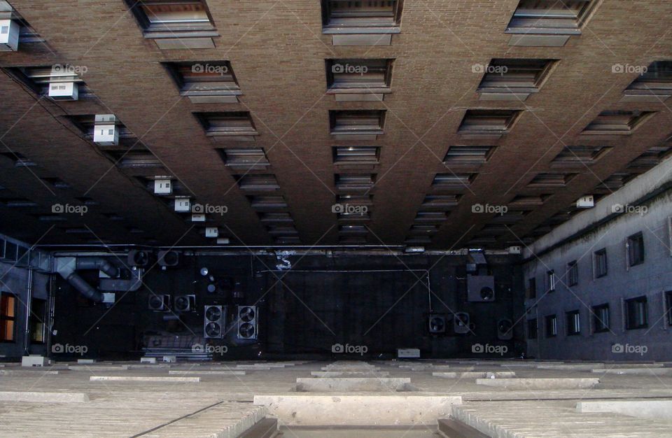 a building, the windows and the air conditioner from a bird's eye view 