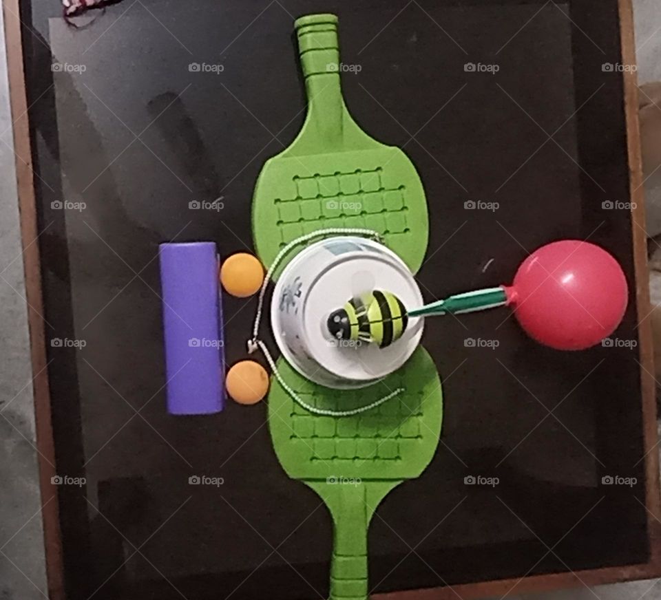 a dragon fly of objects in so many colors made as if it is recycled of materials.