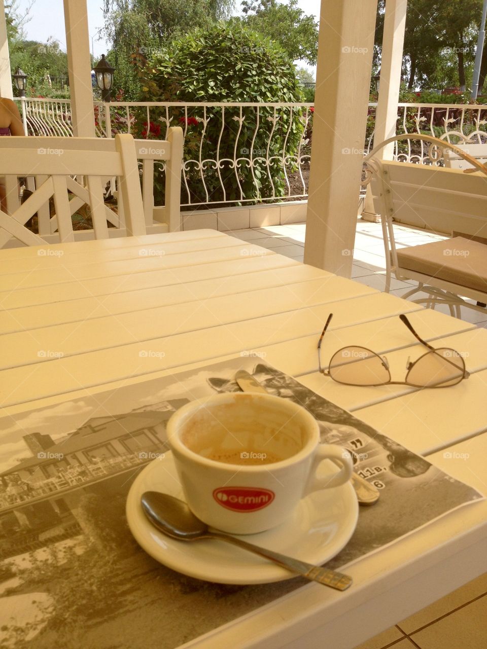 Empty coffee cup on a white wooden table 