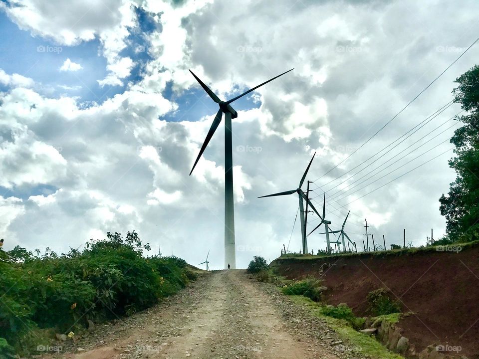 environment fuel and power generation Wind Turbine turbine alternative energy Wind power renewable energy sky environmental conservation Field landscape Land Low angle view Nature cloud - sky day no people rural scene Plant Grass in Ngong, Kenya