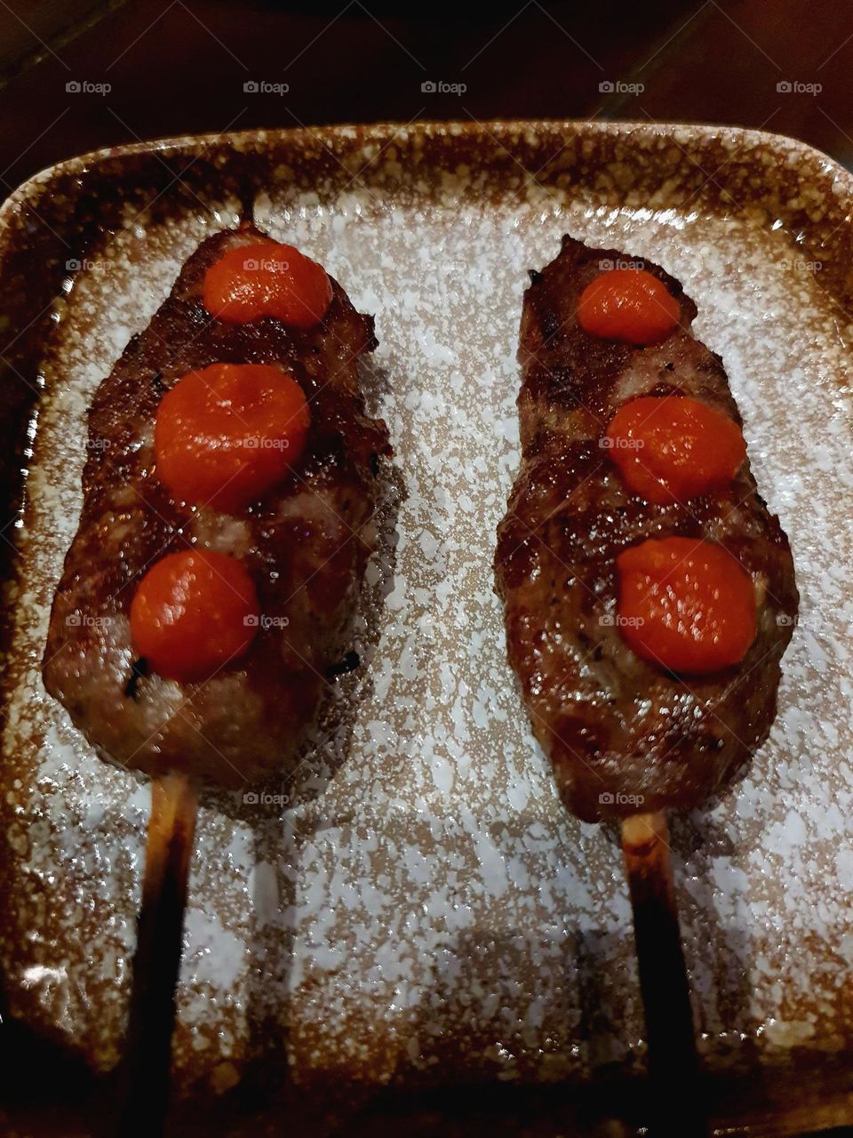 Grilled lamb on sticks