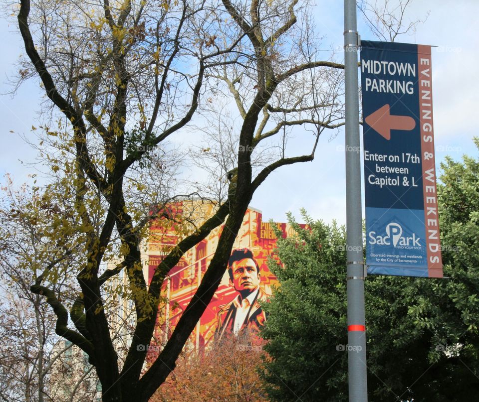 Midtown graffiti artwork in Sacramento California. architecture, tree, flagpole, directions