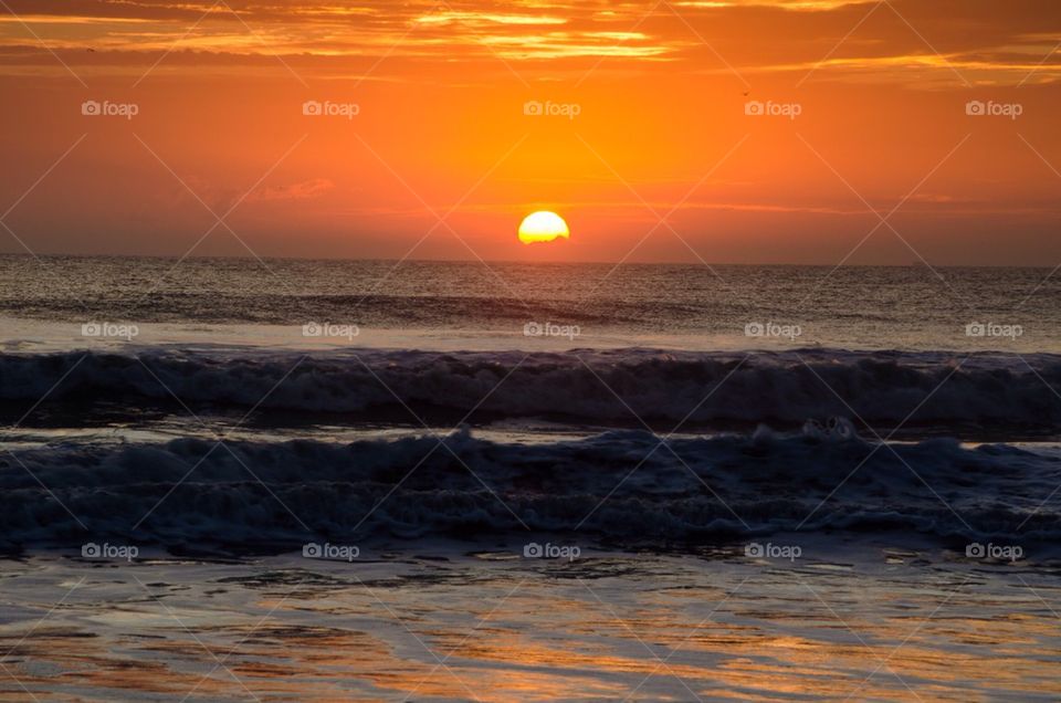 View of beach during sunset