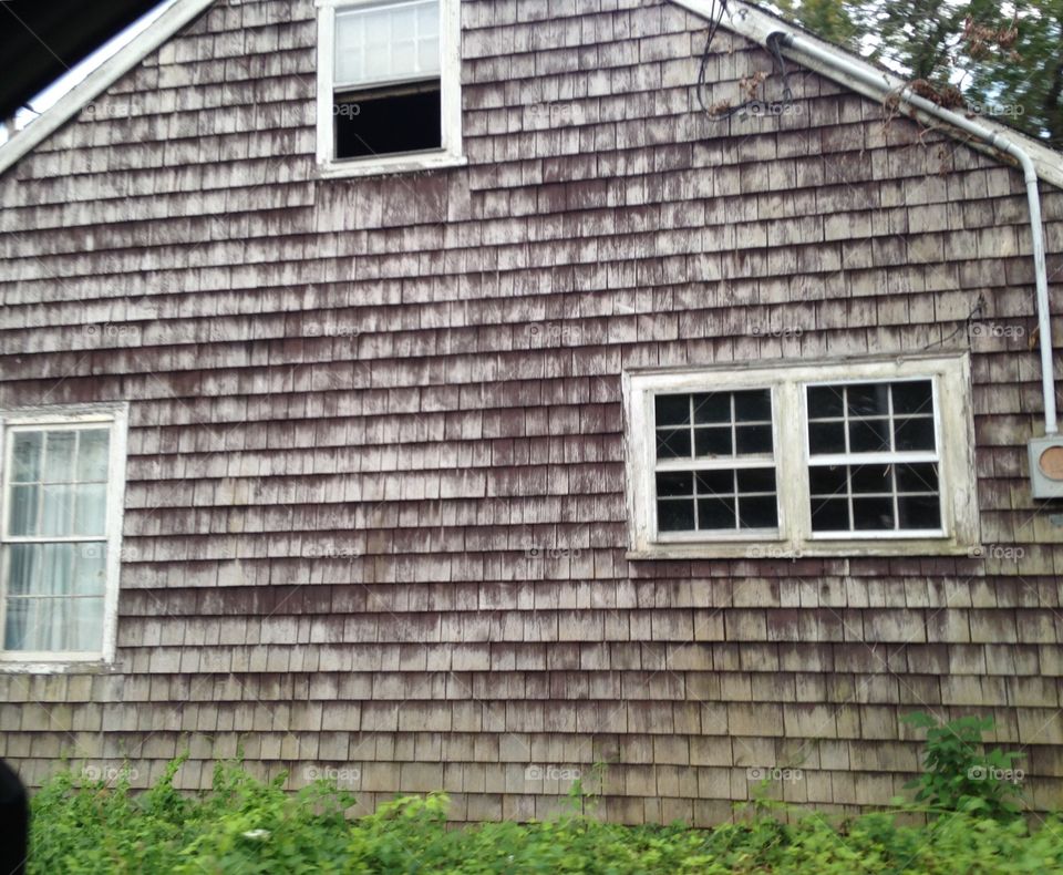 Old abandoned farm house roadside, New England.