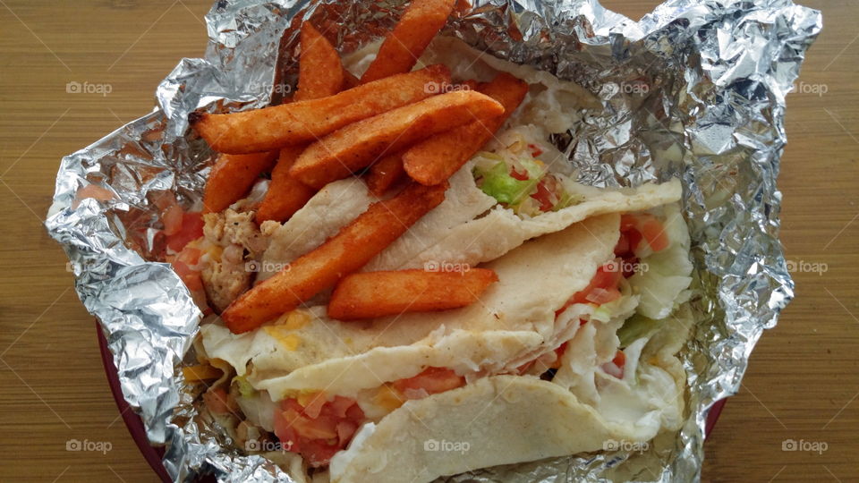 Chicken tacos with sriracha fries.