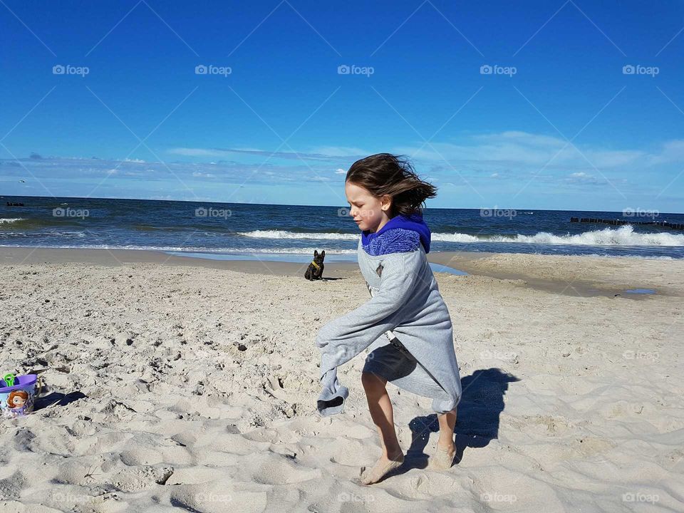 Girl playing at beach