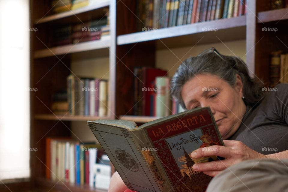 Senior woman reading book