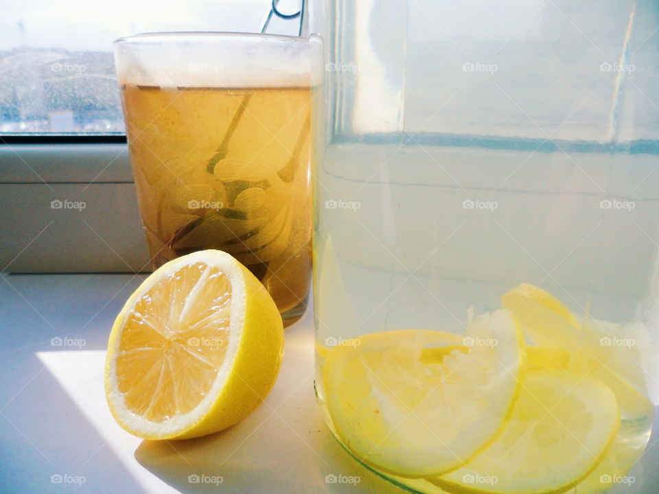 home lemonade with lemon and a cup of tea