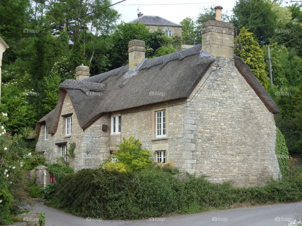English Thatched Roof Stone Cottage