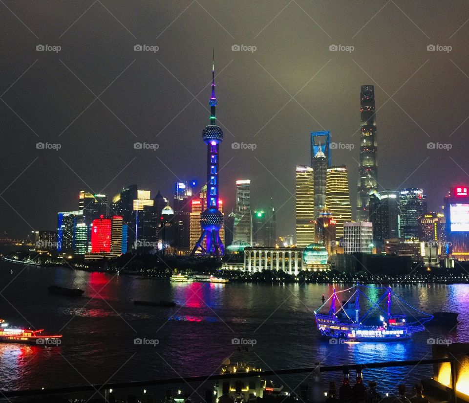 The evening Lujiazui skyline welcomes an approaching summer storm, as seen from the Bund in Shanghai. 