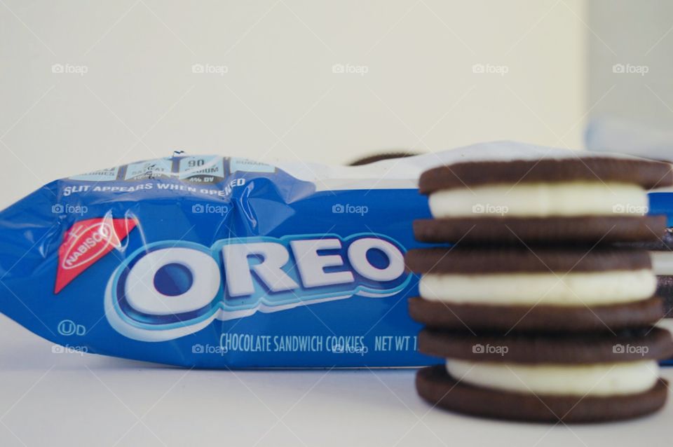 Double stuff Oreo cookies stacked in front of the package