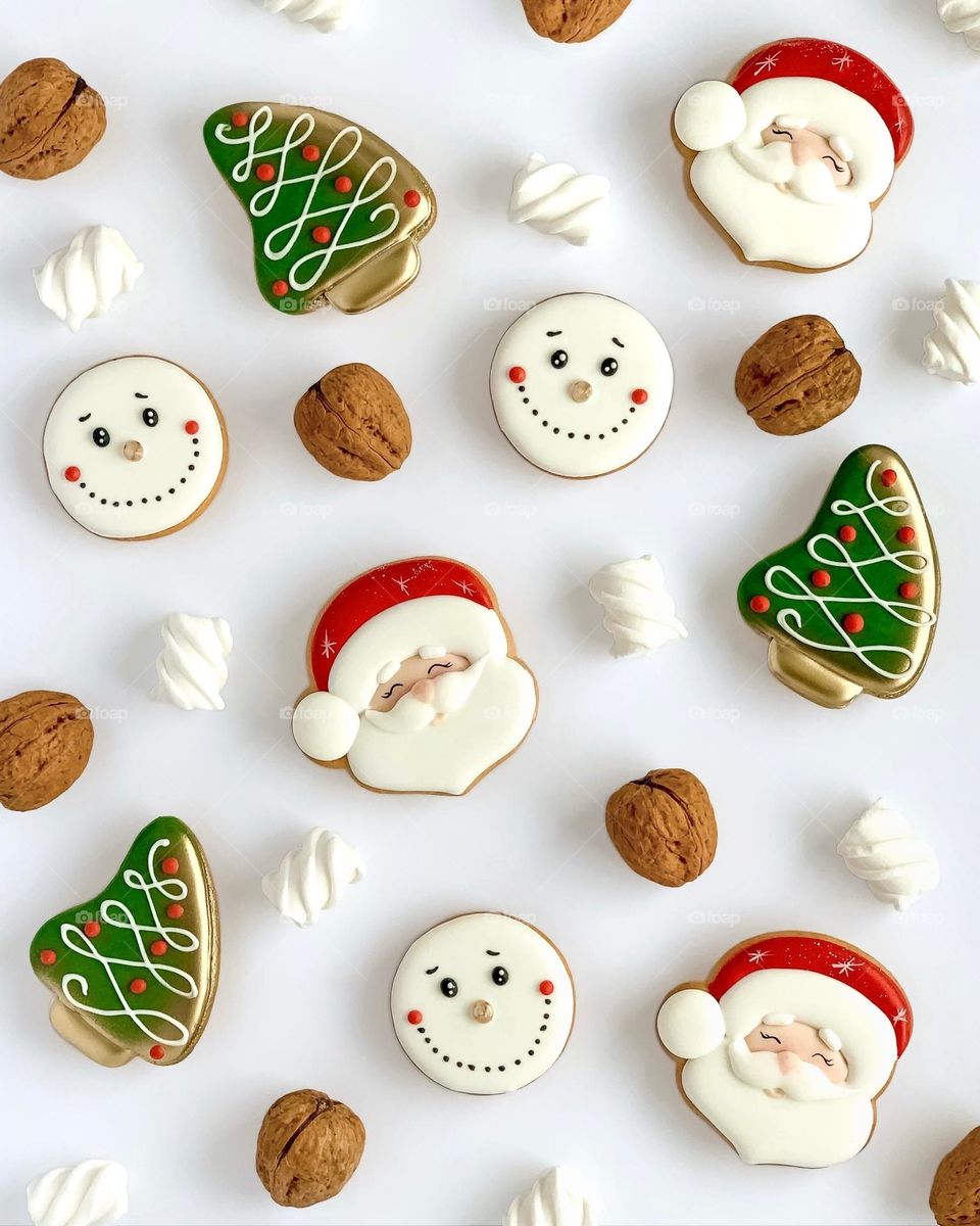 gingerbread pattern in the shape of Santa Claus, Christmas tree and snowman, walnuts, marshmallows