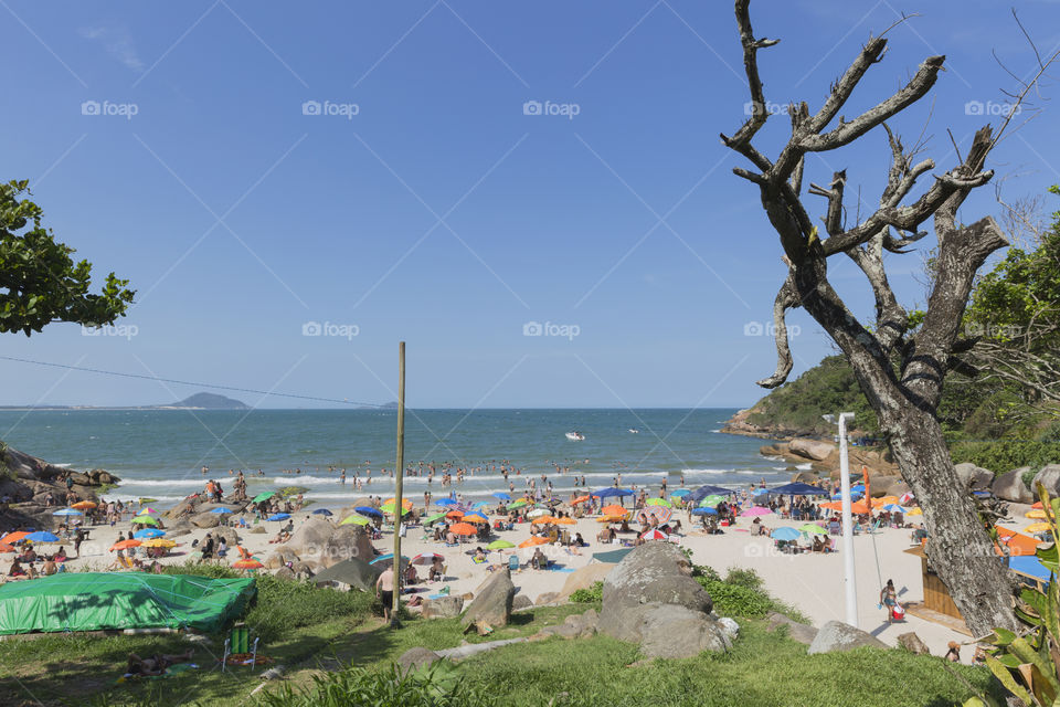 Tourists enjoy the summer on the little beach in Barra da Lagoa in Florianopolis Santa Catarina Brazil.