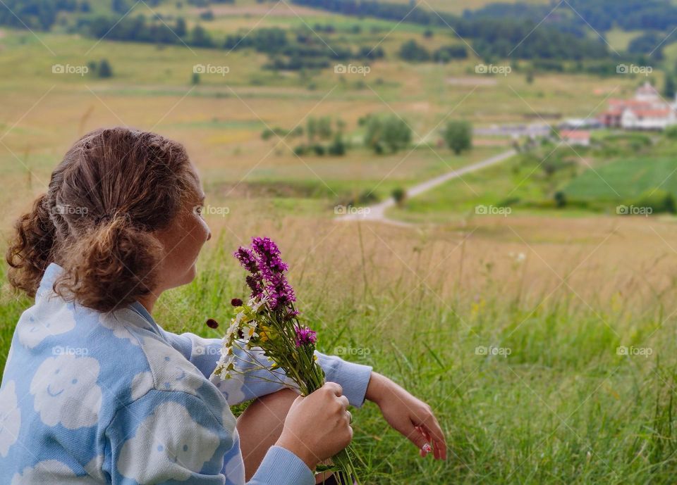 Curly hair and spring flowers