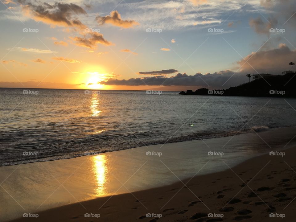 Scenic view of sea at sunset