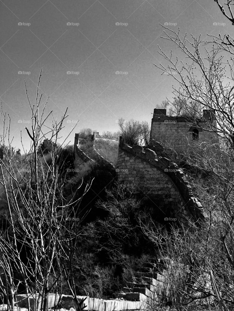 Black and white image of the ruins of the Great Wall near Beijing China 