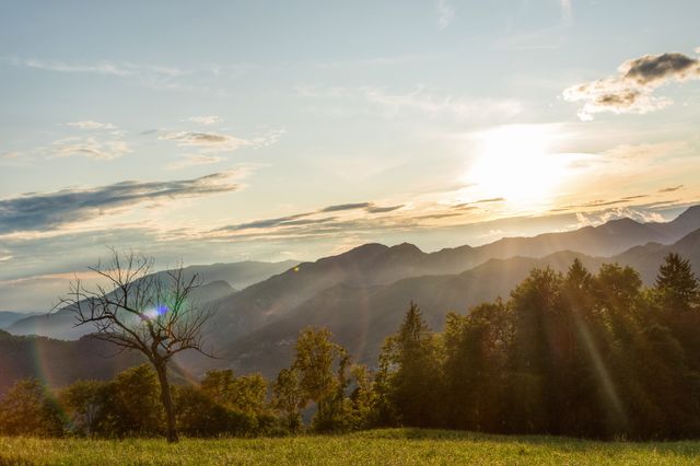 Sunset on alpine landscape in the end of summer, sunlight on the valley 