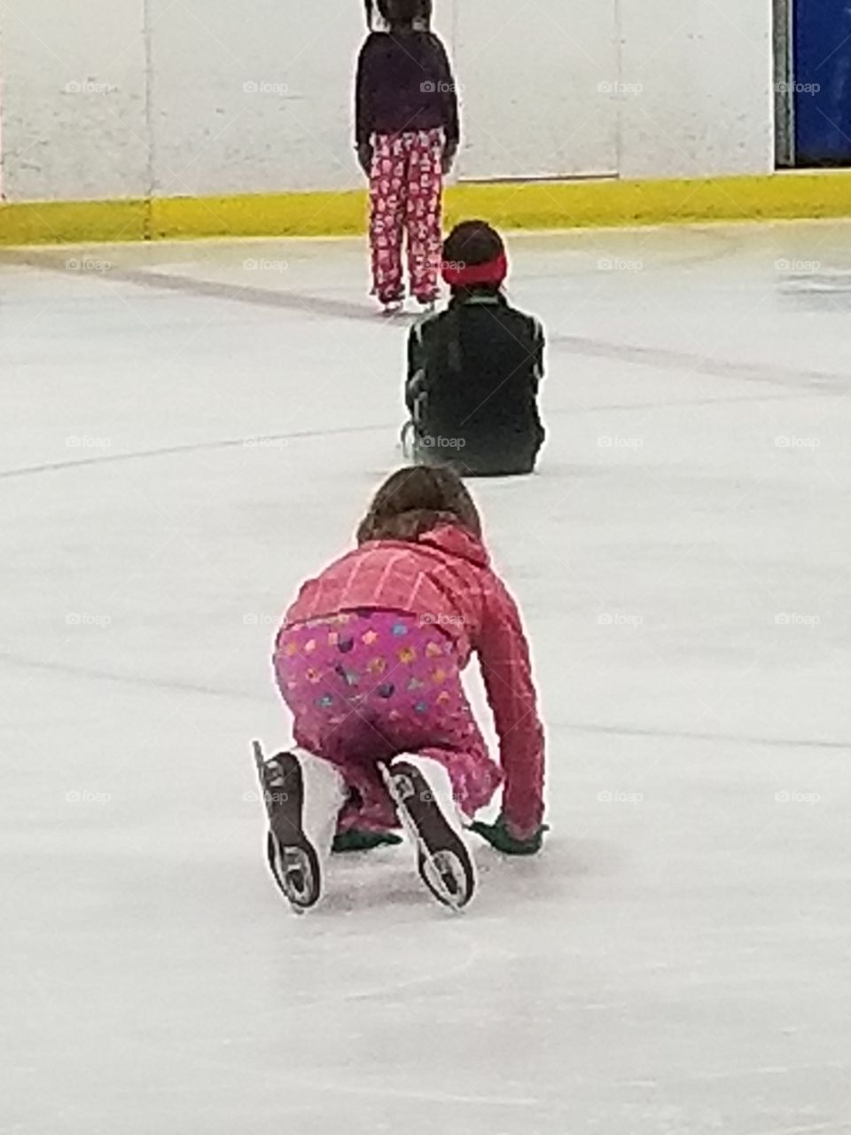 girls playing games while ice skating