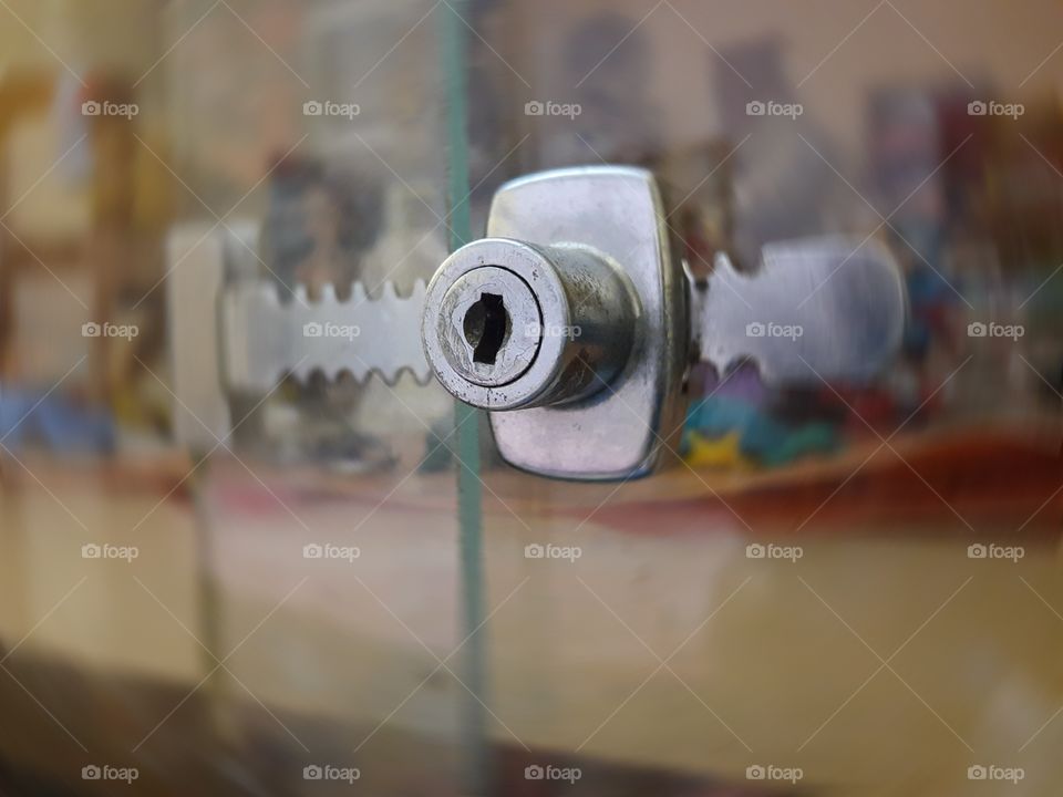 Closeup shot taken of a sliding glass door rachet lock.