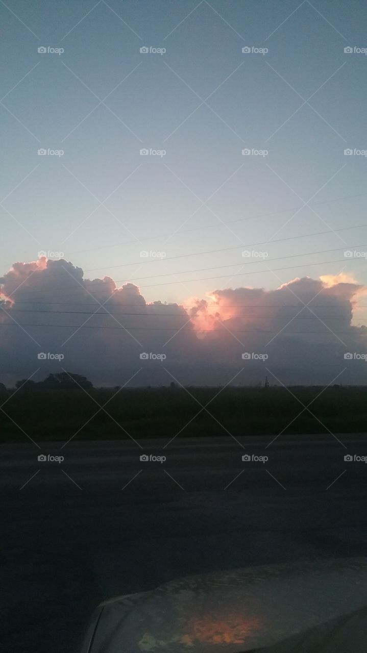 sunrise behind clouds