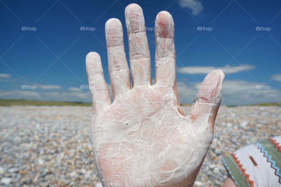 Hand covered in chalk 