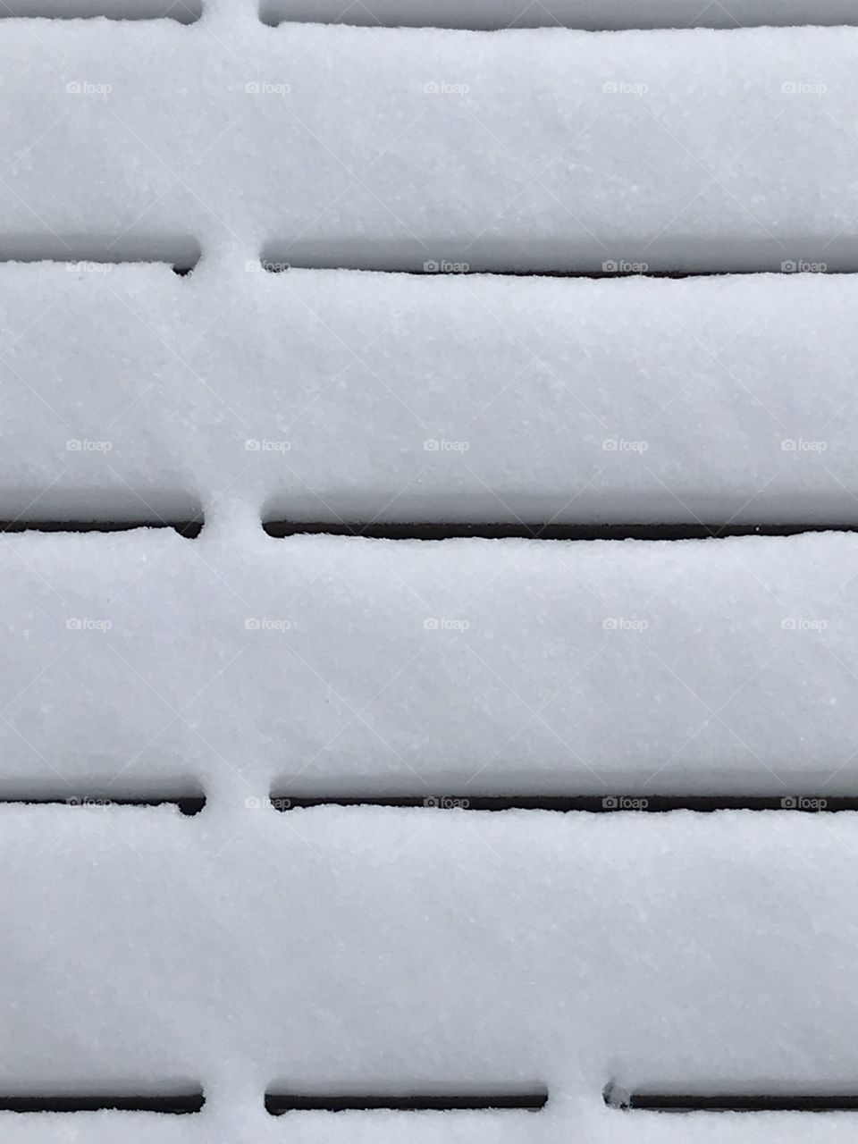 An up close of a snowy deck