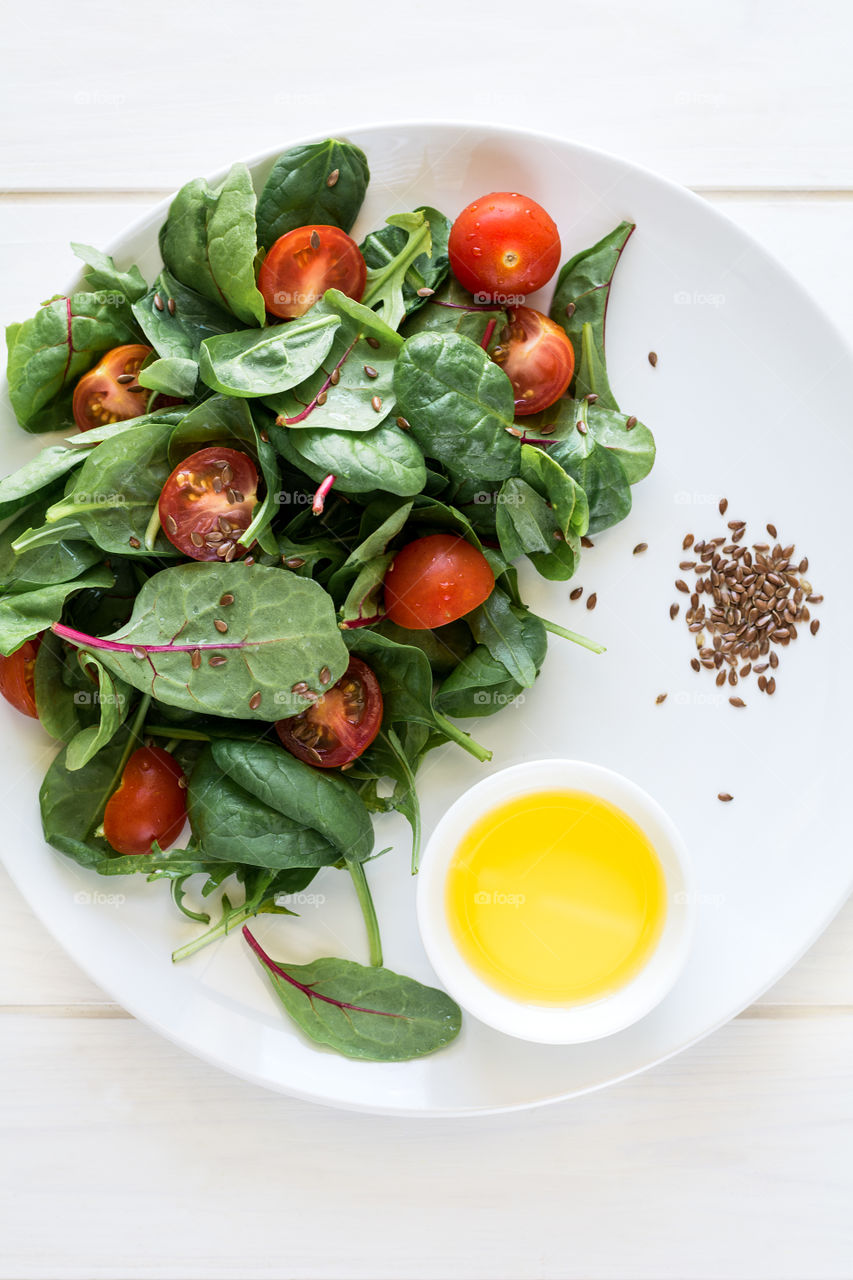 Salad with tomatoes cherry and spinach leaves